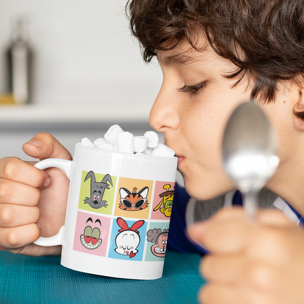 Boy drinking from The Gang's All Here mug with marshmallows.