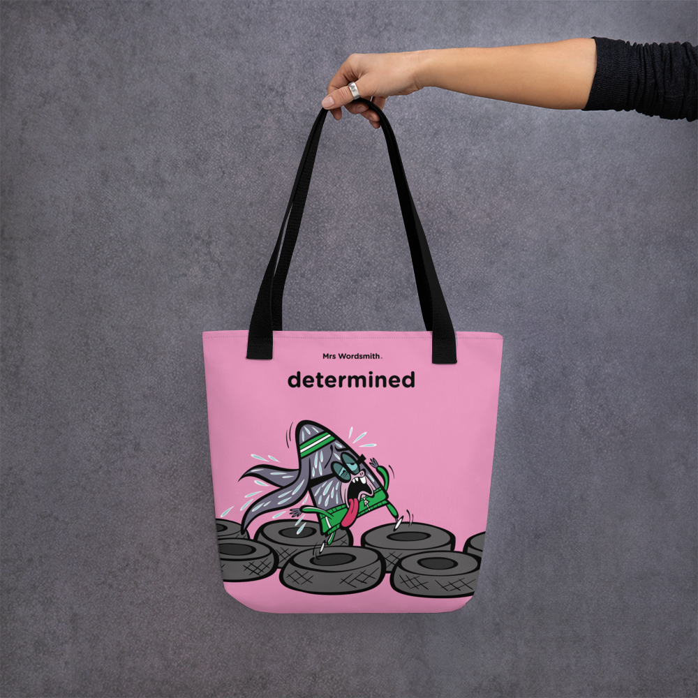 Black 15x15 all-over-print tote bag with determined graphic.