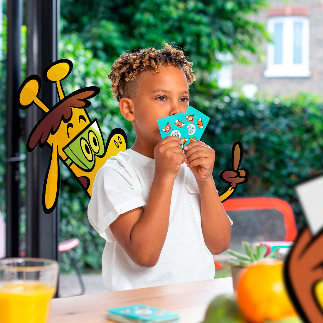 Boy holding cards with giraffe cartoon